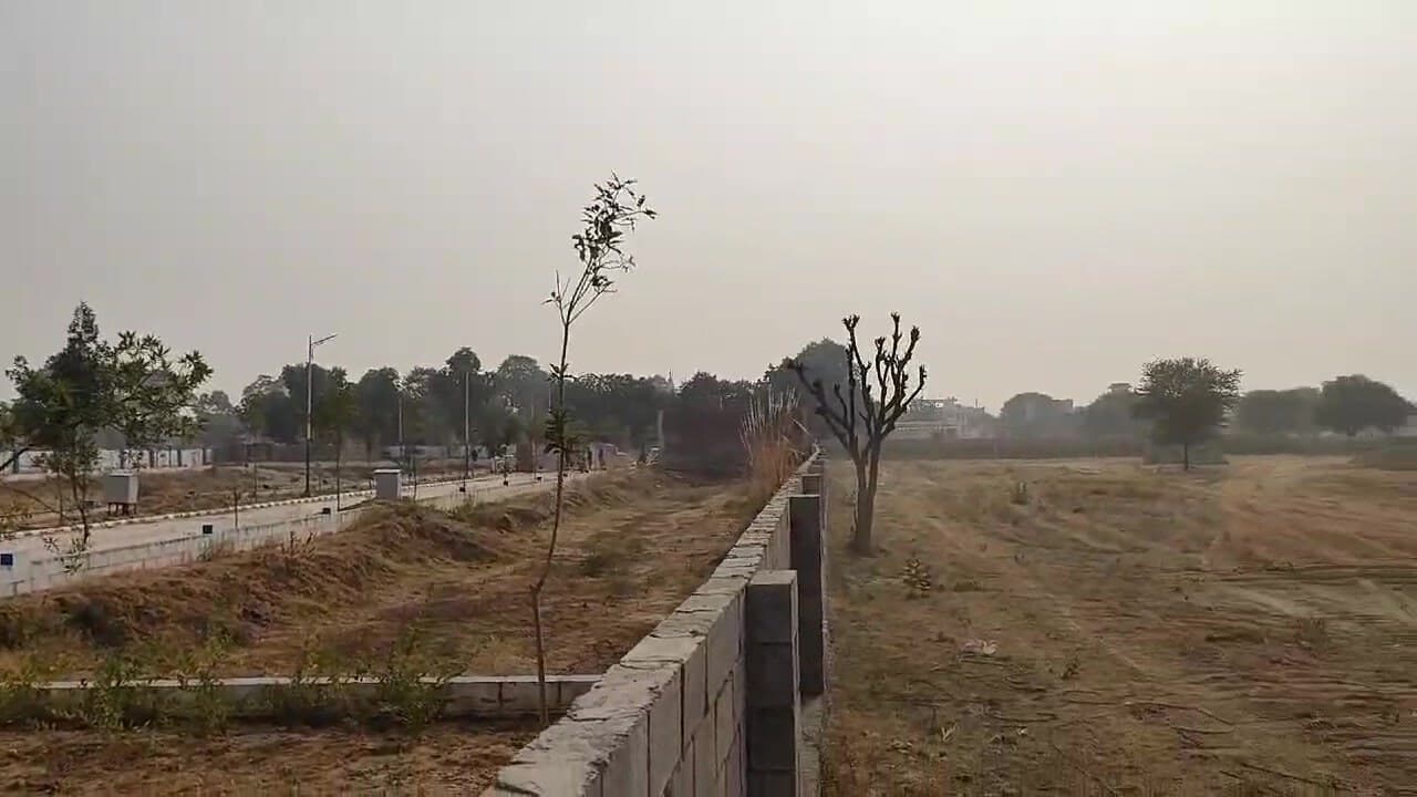 Sagar Enclave — Boundary wall and open plots